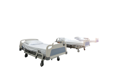 Two hospital beds, one closer and with detailed view, against a black background