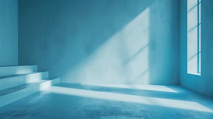 Obraz premium Minimalist blue room with stairs and window casting light creating shadows on the wall and floor