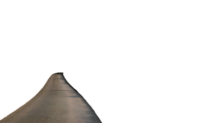 A grayscale, curving road stretches into a dark void. Light outlines the pavement