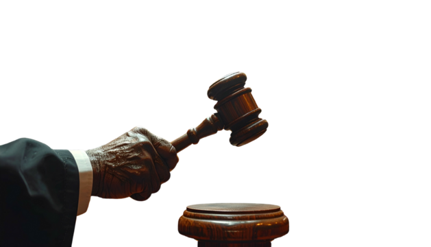 Hand of judge in robes holding a gavel, poised to strike a judgment
