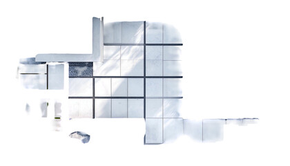 Overhead view of a tiled, modern space with a sharp-angled design, shadows