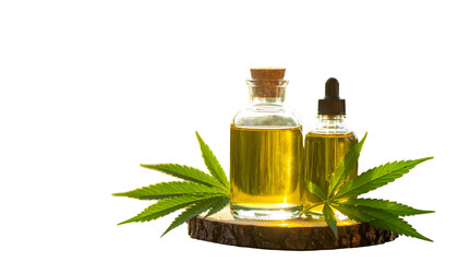 Two amber glass bottles of oil with a dropper and cannabis leaves, on wood