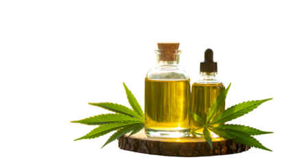Two amber glass bottles of oil with a dropper and cannabis leaves, on wood
