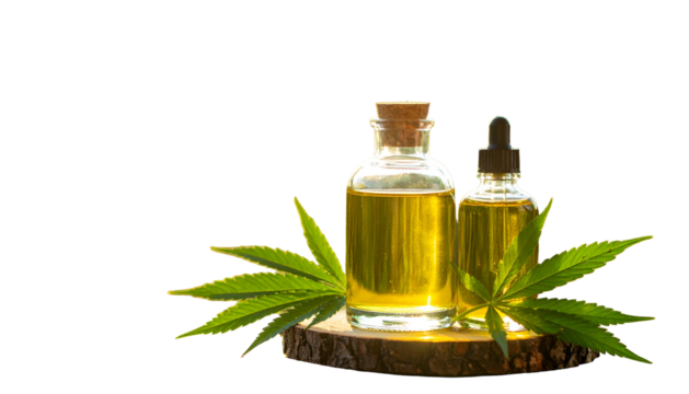 Two amber glass bottles of oil with a dropper and cannabis leaves, on wood