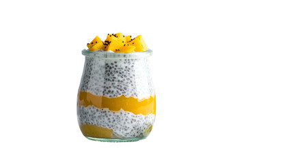 A layered dessert in a glass jar, topped with diced yellow fruit and seeds