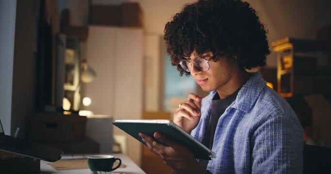 Logistics, smile and tablet with man in office at night for delivery or shipping schedule. App, distribution and scroll with person in dark supply chain depot for agenda or overnight order tracking