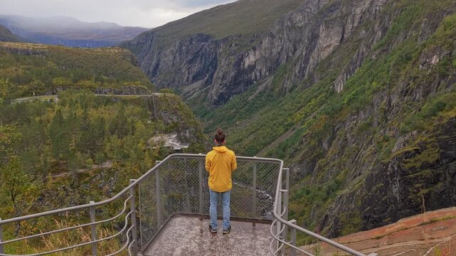 Topdown view of visitors walking along Voringfossen cliffs, Norway