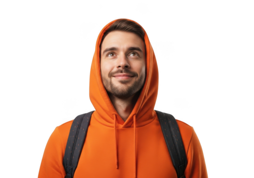 Young man wearing an orange hooded sweatshirt and backpack looking upwards with a slight smile isolated on transparent background