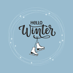 Hello Winter hand lettered phrase with hanging ice skates in a circle of blade trails and sparks