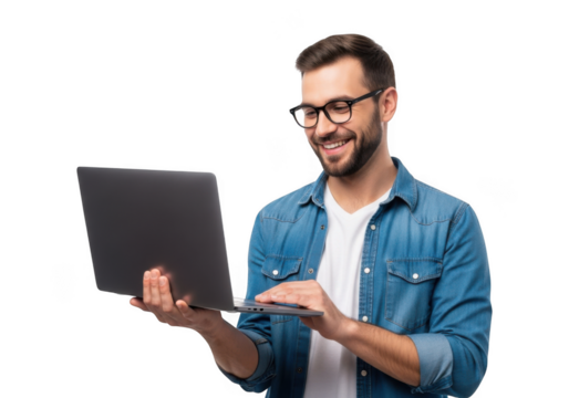 Smiling man wearing glasses and a denim shirt holding a laptop and typing isolated on transparent background