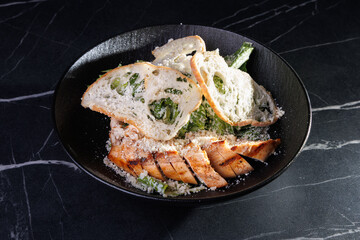 Salmon Fillet With Greens and Parmesan Crumbs Over Bread Slices