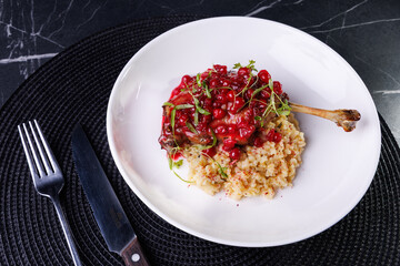 Gourmet Lamb Shank With Cranberry Sauce On Creamy Risotto