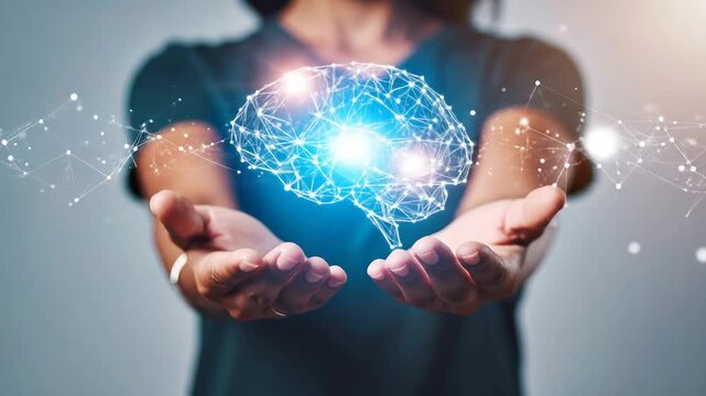Person holding glowing brain representing artificial intelligence and technology.