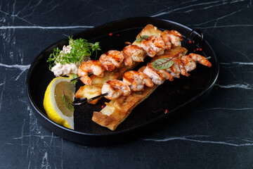 Gourmet Shrimp Skewers on Crispy Bread with Lemon Wedge and Fresh Green