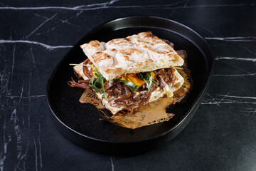 Artisan Pulled Pork Sandwich With Egg, Greens, And Flatbread