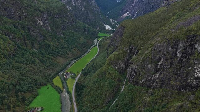 Aerial view of Stalheim Pass winding through steep green valley in Norway