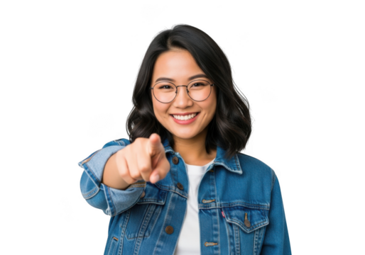 A young woman with dark hair and glasses smiles and points forward isolated on transparent background