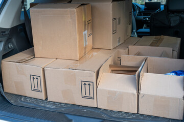 cardboard boxes in SUV trunk