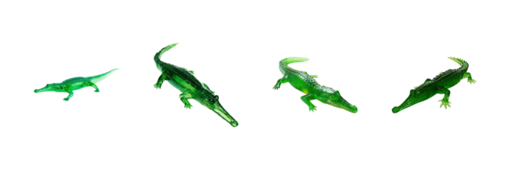 Green Plastic Alligator Figurines Set. Toy Reptile Models For Educational And Decorative Use Collection Isolated On Transparent Background