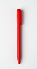 A vibrant red plastic ballpoint pen, capped, resting horizontally on a pure, clear white background, highlighting office supplies and simplicity ,memo, education, background