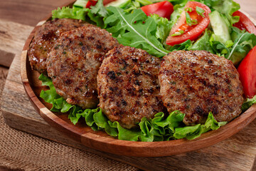 Fried cutlets, mixed minced meat, with vegetable salad, homemade, top view, no people,