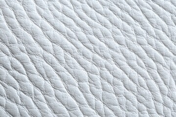 Elegant white leather texture showcasing smooth surface with subtle indentations and waves, adding captivating relief and a contemporary aesthetic to interior design and fashion projects