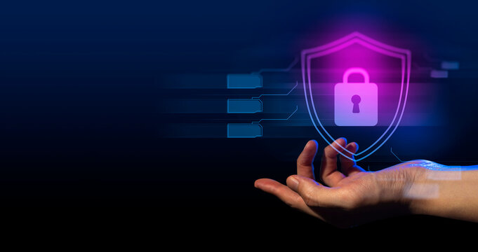 hand of businessman interactive touching a holographic anti-virus security shield system network and technology, success of innovation