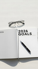 2026 Goals Planner with Pen and Eyeglasses on White Desk