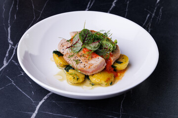 Gourmet Pork With Potatoes and Fresh Greens Plated