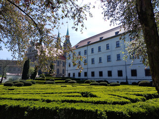 Explore a peaceful garden in a European estate, Brzeg, Poland