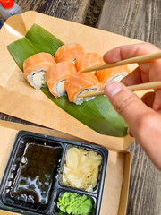 Fresh sushi roll meal with soy sauce and chopsticks