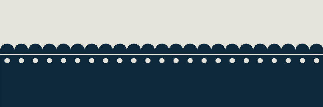 A simple decorative border with scalloped edges and polka dots separating a beige and dark blue background