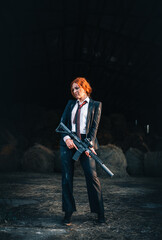 Redhead woman in a suit with a rifle