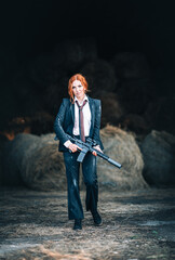 Redhead woman in a suit with a rifle