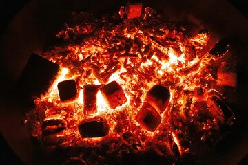 burning wood in a bonfire in close up at night