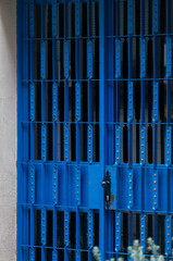 Obraz premium Blue entry door with modern wrought iron and a historic look