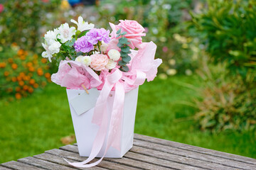 Bunch of flowers in a vase in the garden
