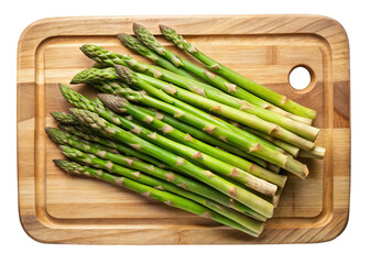 Fresh green asparagus spears arranged on a wooden cutting board isolated on transparent background