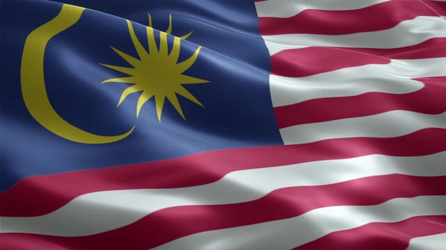 The national flag of Malaysia, known as Jalur Gemilang, waving gracefully in the wind, showcasing its vibrant colors and patriotic design.