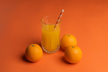 orange juicy oranges on an orange background.