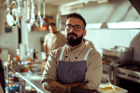 Adult man chef looking confident in restaurant kitchen