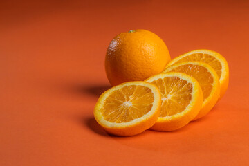 orange juicy oranges on an orange background.