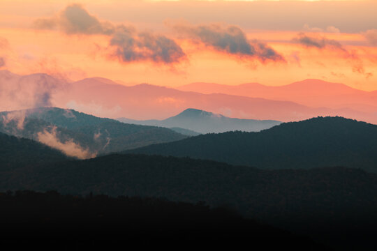 Mountain layers during moody pink sunrise