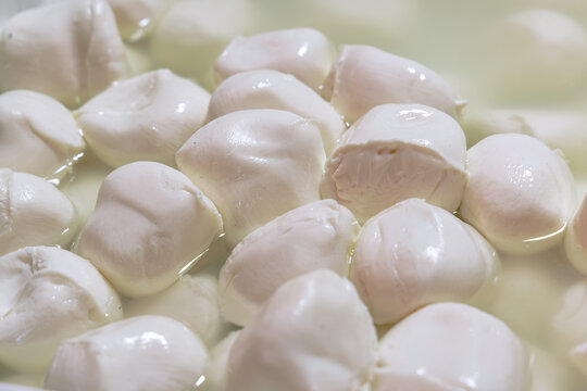 Fresh soft Italian white cheese mozzarella buffalo at the food market in Palermo. Sicily