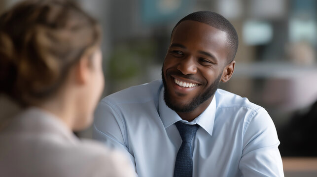 Faceless happy black man therapist in consultation meeting defocused hospital background healthcare discussion mental health therapy African male person physiology counseling