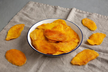 Organic Dried Mangos on a Plate, side view.