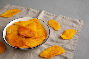 Organic Dried Mangos on a Plate, side view.