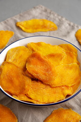 Organic Dried Mangos on a Plate, side view.