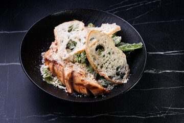 Salmon Fillet With Greens and Parmesan Crumbs Over Bread Slices