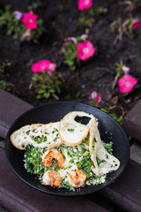 A Picnic Dish in the Garden with Yogurt, Roasted Chicken. brightly blooming Flowers